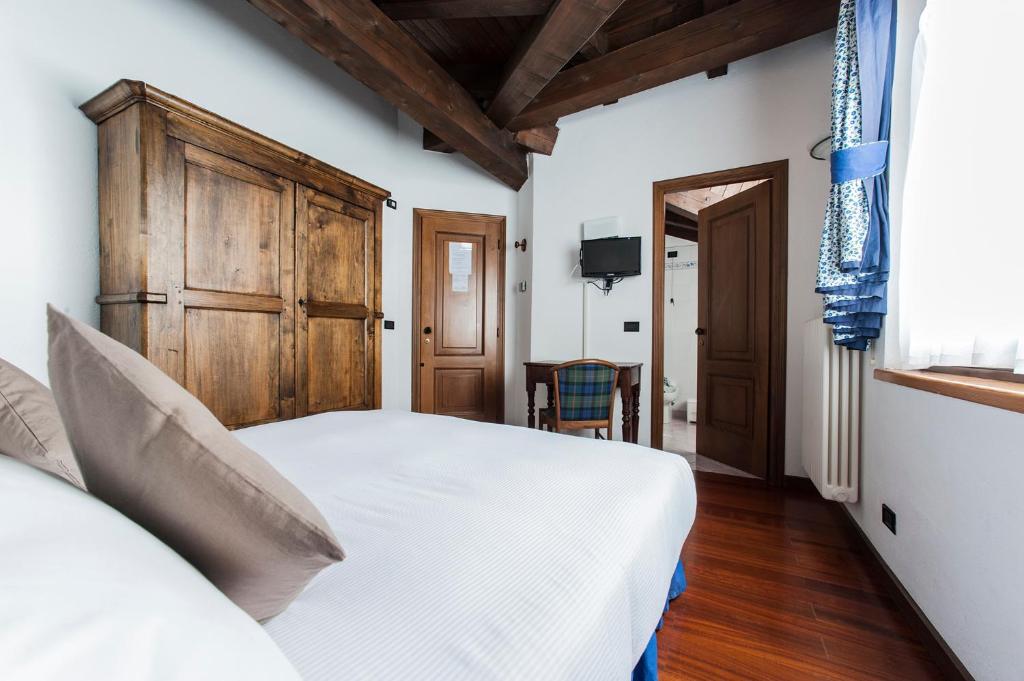Postel nebo postele na pokoji v ubytování Hotel Baita Cretaz