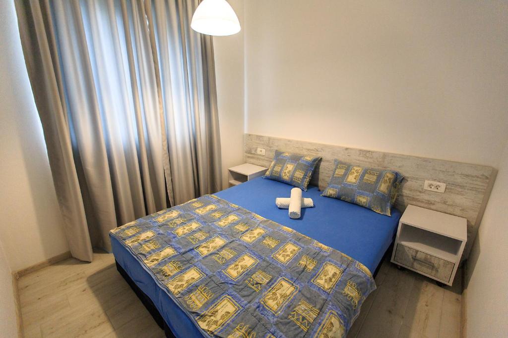 Postel nebo postele na pokoji v ubytování Apartments Sarić