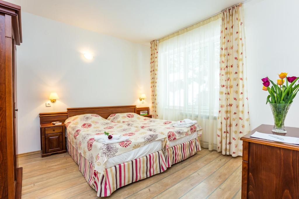 Postel nebo postele na pokoji v ubytování The Stream Resort