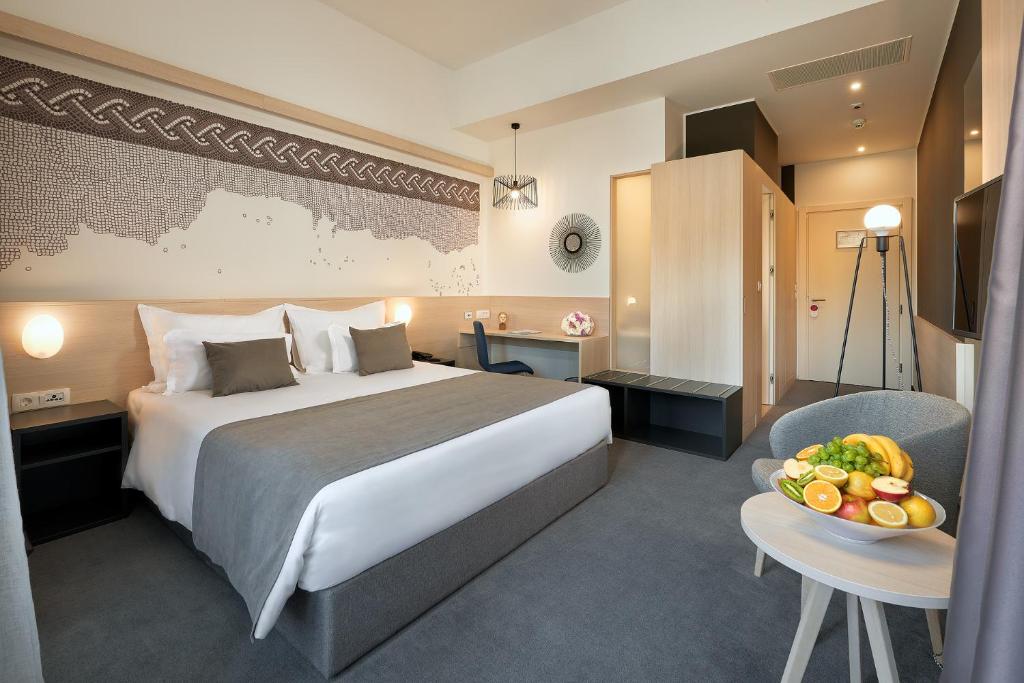 Posteľ alebo postele v izbe v ubytovaní Hotel Salona Palace