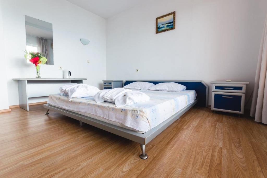 Postel nebo postele na pokoji v ubytování Plovdiv Hotel