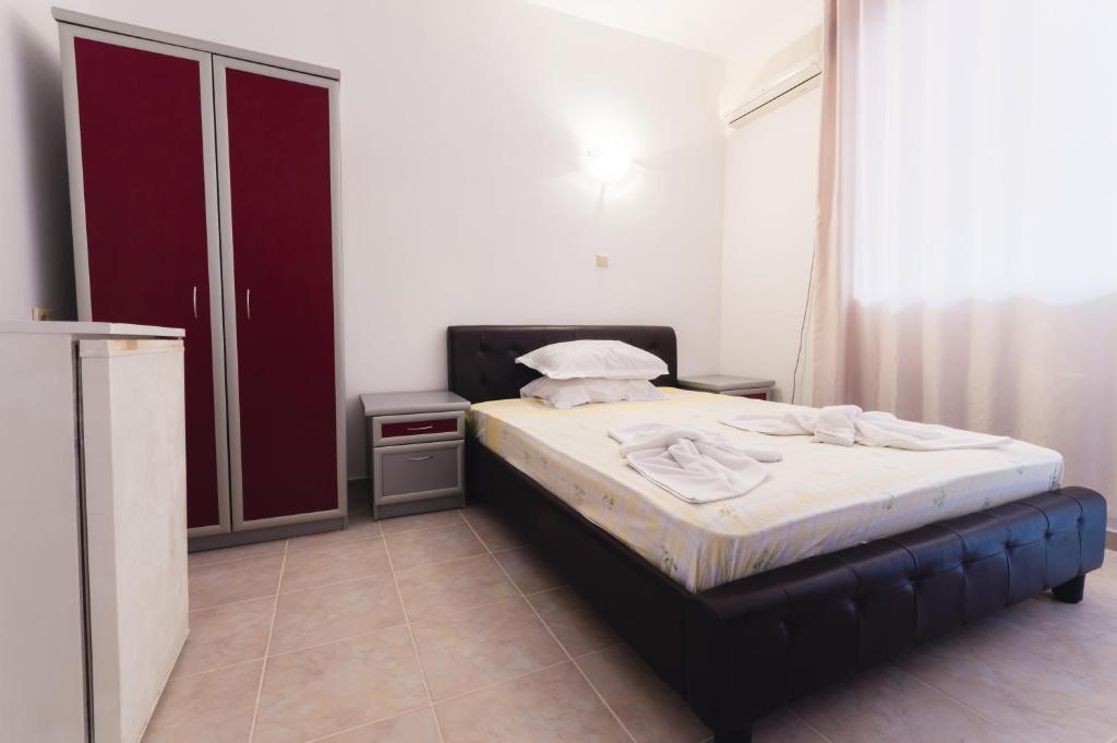 Postel nebo postele na pokoji v ubytování Plovdiv Hotel