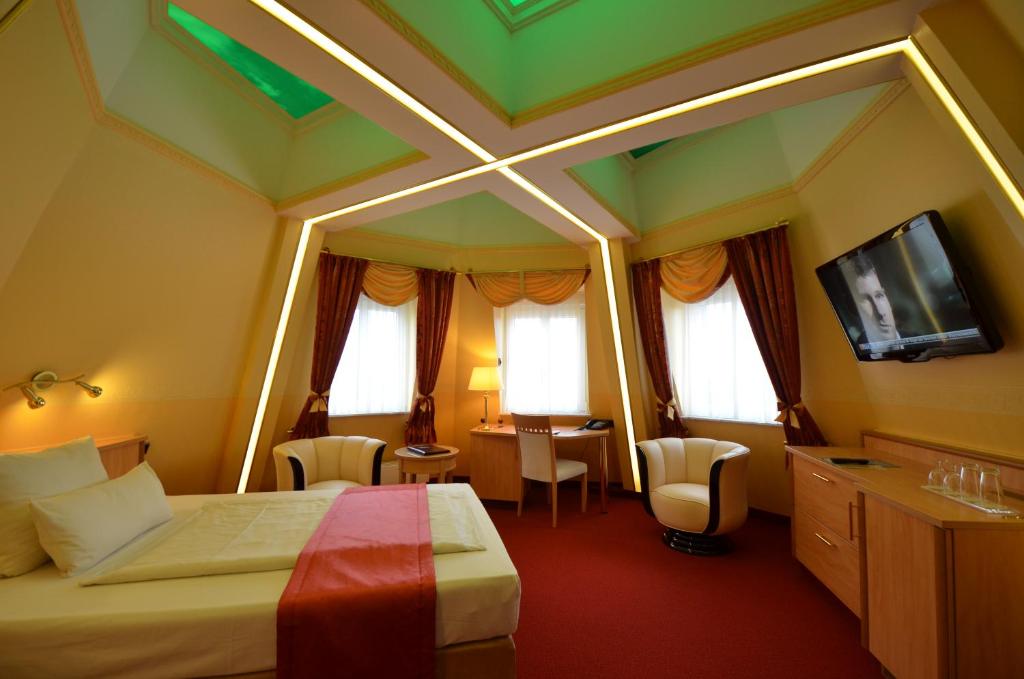 TV a/nebo společenská místnost v ubytování Hotel Mack Private Inn