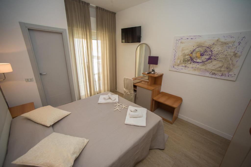 Postel nebo postele na pokoji v ubytování Hotel Ermeti B&B Brunch