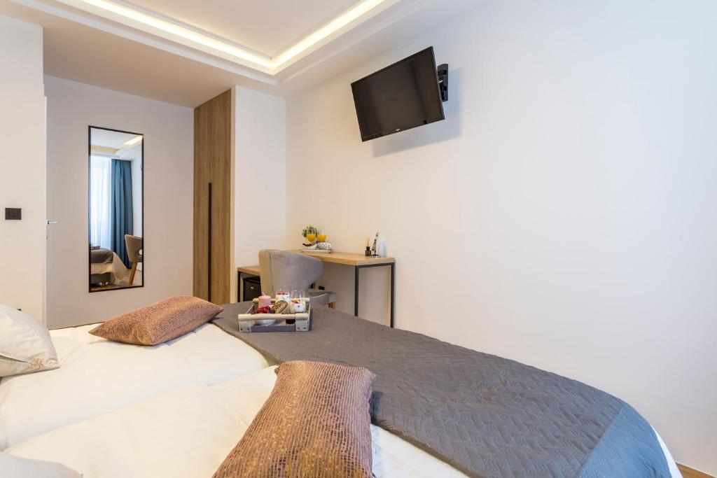 Postel nebo postele na pokoji v ubytování Central Rooms Split