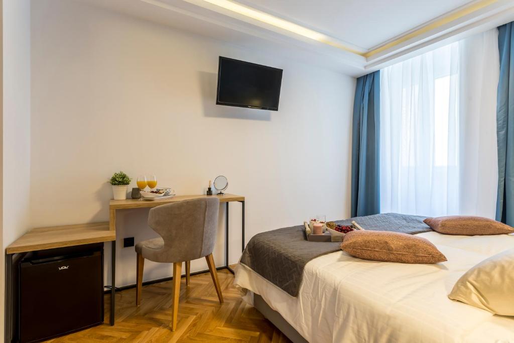 Postel nebo postele na pokoji v ubytování Central Rooms Split