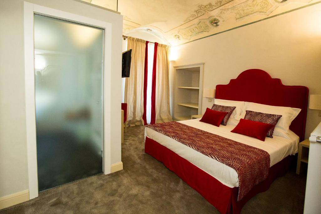 Postel nebo postele na pokoji v ubytování Palazzo Franceschini