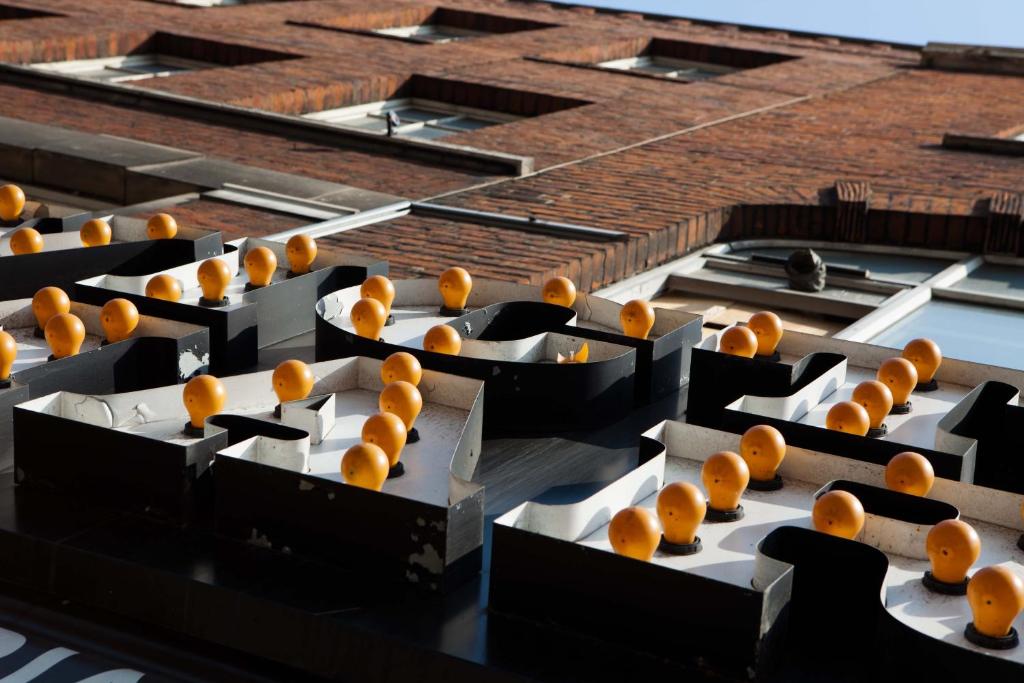 a bunch of oranges sitting on top of a building at The Z Hotel Victoria in London