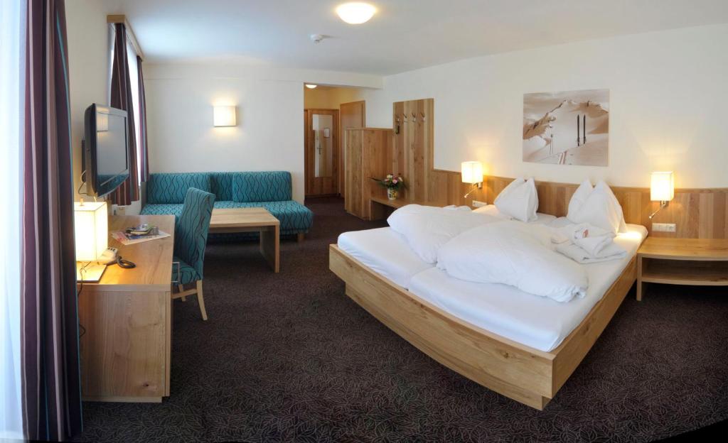 Postel nebo postele na pokoji v ubytování Panoramahotel Gürtl
