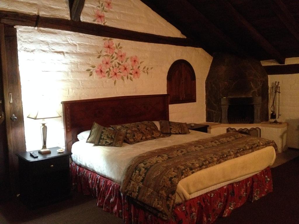 Postel nebo postele na pokoji v ubytování Hotel y Hosteria Natabuela