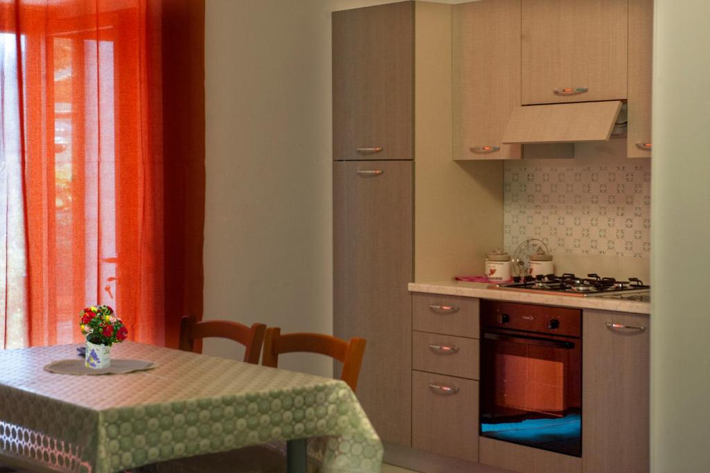 Kuchyň nebo kuchyňský kout v ubytování Case Vacanze Rossi