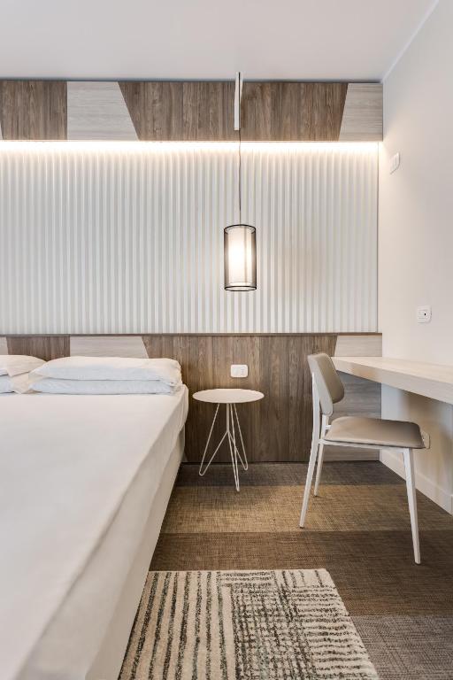 A bed or beds in a room at Hotel Europa