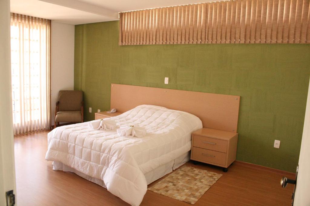 
Cama ou camas em um quarto em Hotel Colonial Gold
