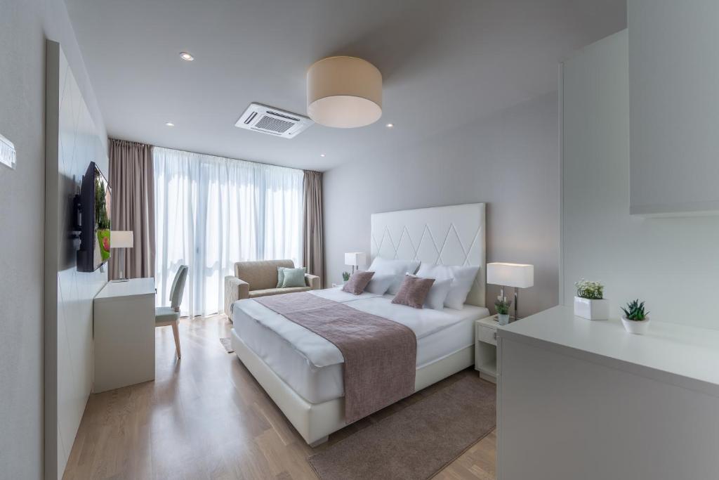 Letto o letti in una camera di Apartments & Rooms Preelook