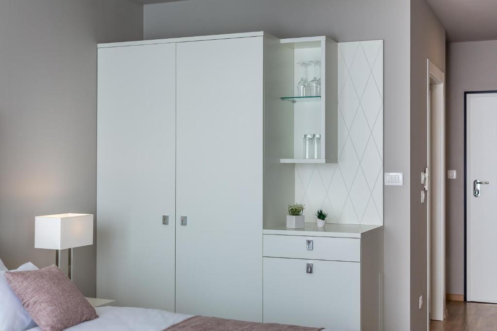 Letto o letti in una camera di Apartments & Rooms Preelook