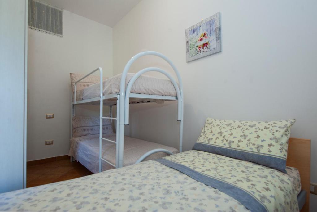 Postel nebo postele na pokoji v ubytování Case Vacanze Rossi
