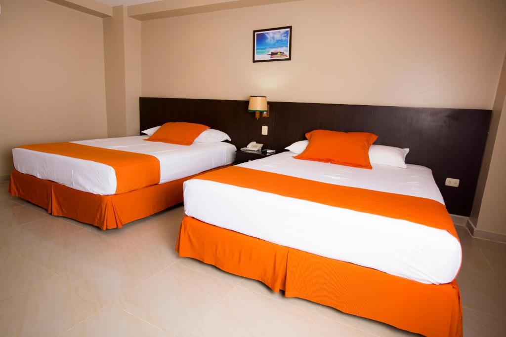 Postel nebo postele na pokoji v ubytování Hotel Los Almendros