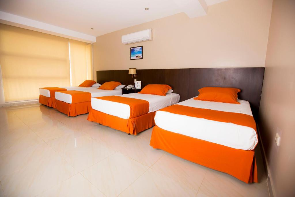 Postel nebo postele na pokoji v ubytování Hotel Los Almendros