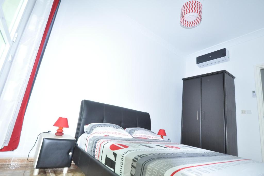 Кровать или кровати в номере Appart Clim Wifi 700m de la Plage