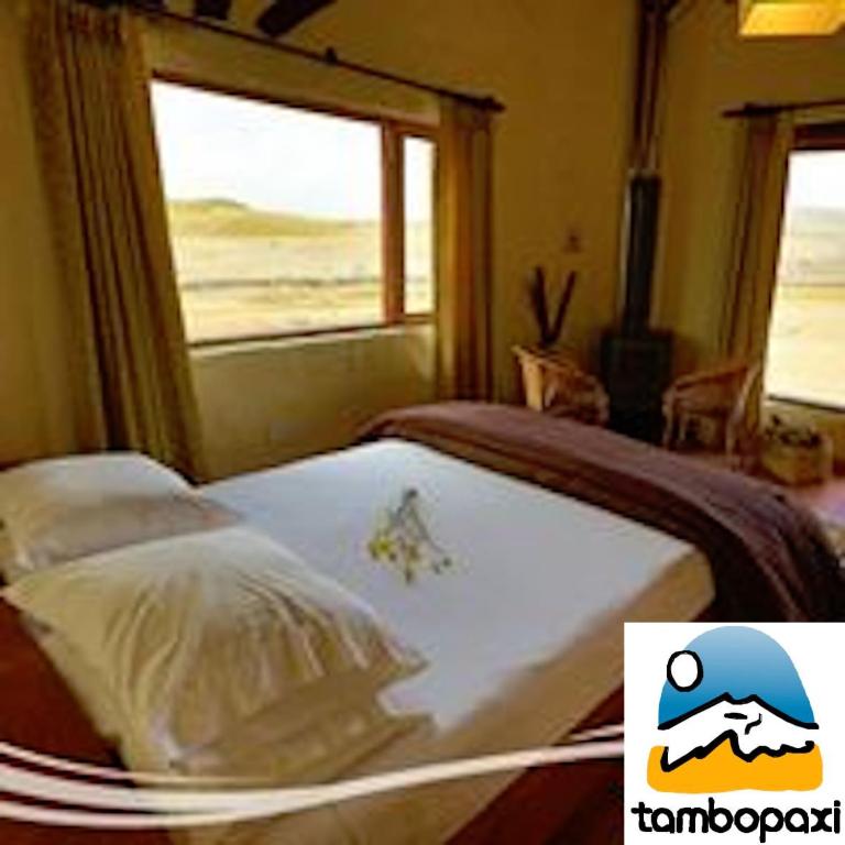 Postel nebo postele na pokoji v ubytování Hotel Tambopaxi