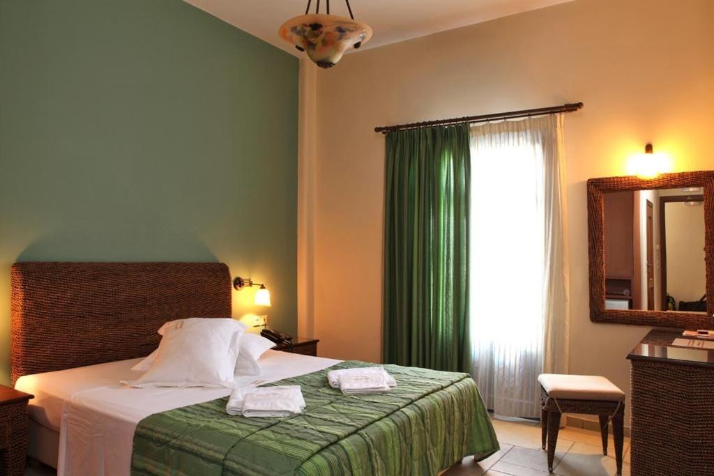 Ένα ή περισσότερα κρεβάτια σε δωμάτιο στο Ξενώνας Αφροδίτη