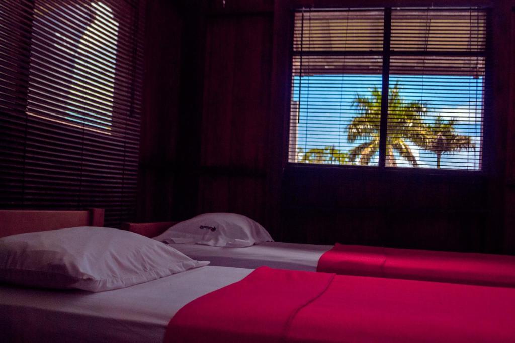 Postel nebo postele na pokoji v ubytování Hotel Utüane