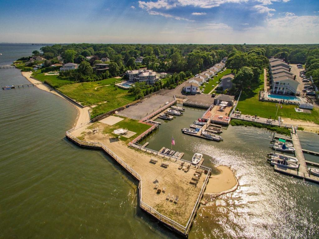 an aerial view of a dock with boats in the water at Colonial Shores Resort in Hampton Bays