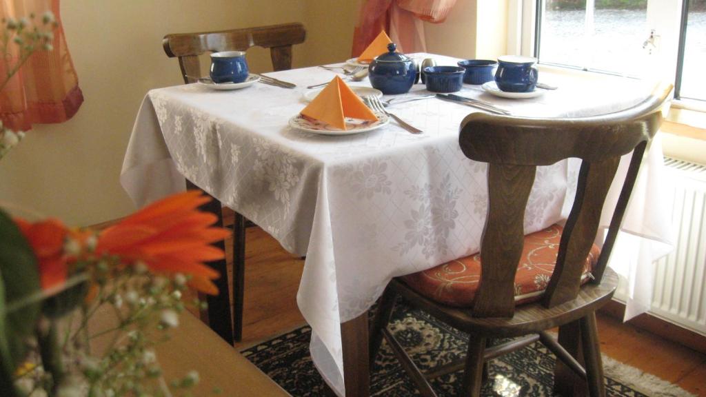 a table with a plate of food on it at An Bruachan B&B in Kenmare