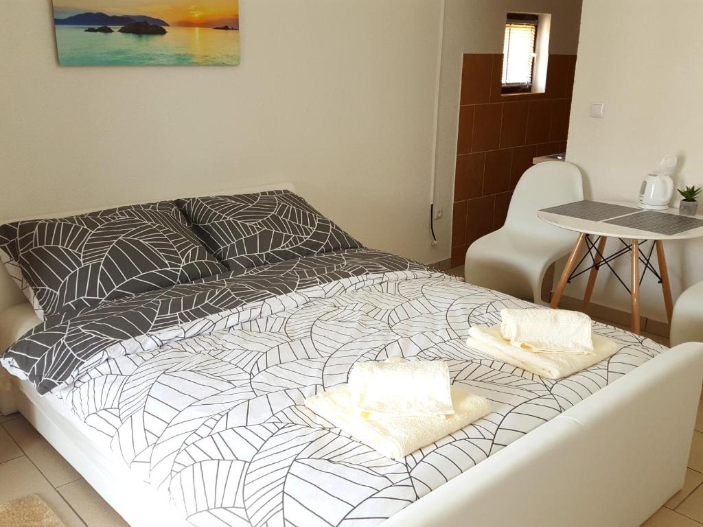 Postel nebo postele na pokoji v ubytování Apartments Merion
