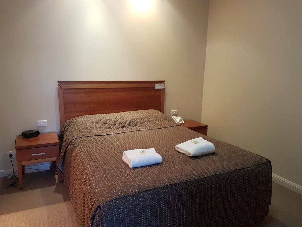 Postel nebo postele na pokoji v ubytování Vine Inn Barossa