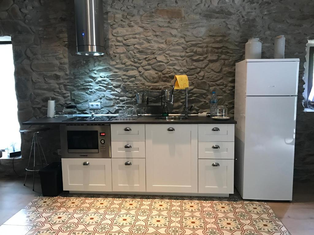 Kuchyň nebo kuchyňský kout v ubytování Hostal Sant Roc