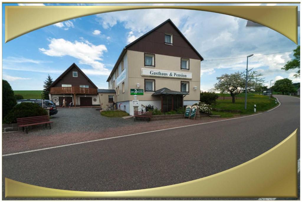 a building on the side of a road at Gasthaus Falkenhain in Kurort Altenberg