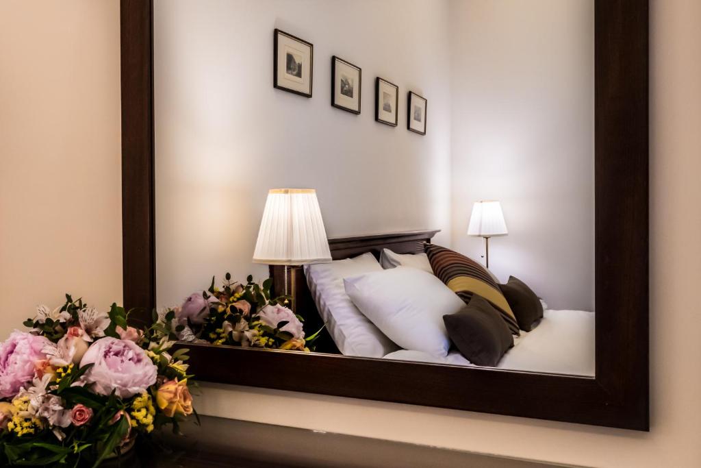 Postel nebo postele na pokoji v ubytování Rex Hotel