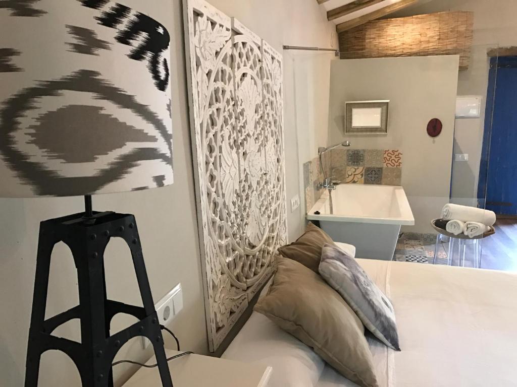 Postel nebo postele na pokoji v ubytování Hostal Sant Roc