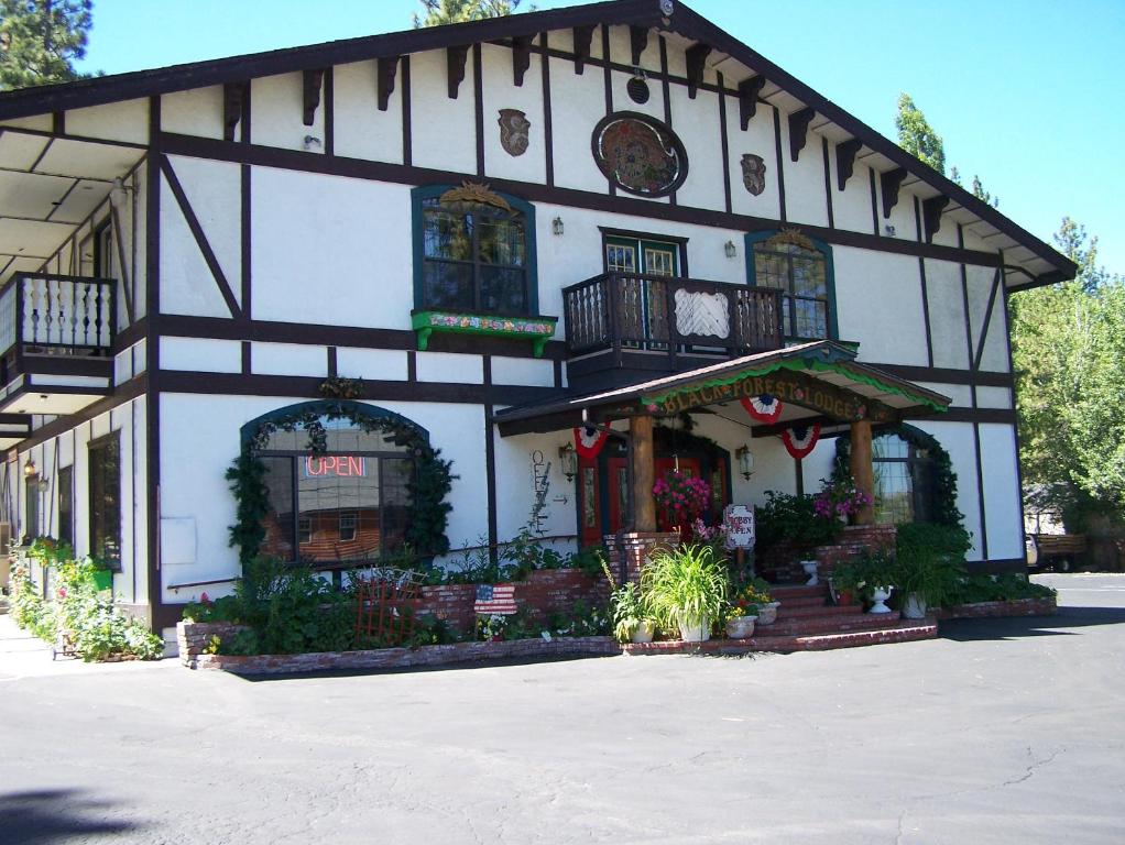 a building with a sign on the front of it at Black Forest Lodge in Big Bear Lake