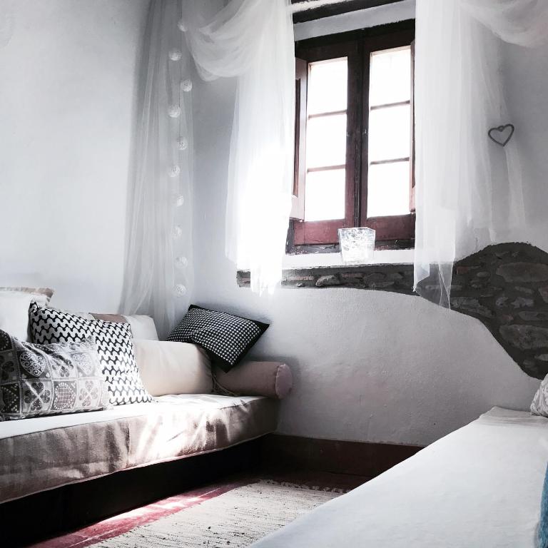 Postel nebo postele na pokoji v ubytování Hostal Sant Roc