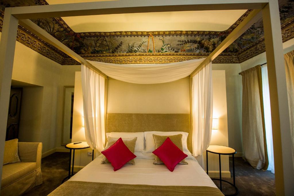 Postel nebo postele na pokoji v ubytování Palazzo Franceschini