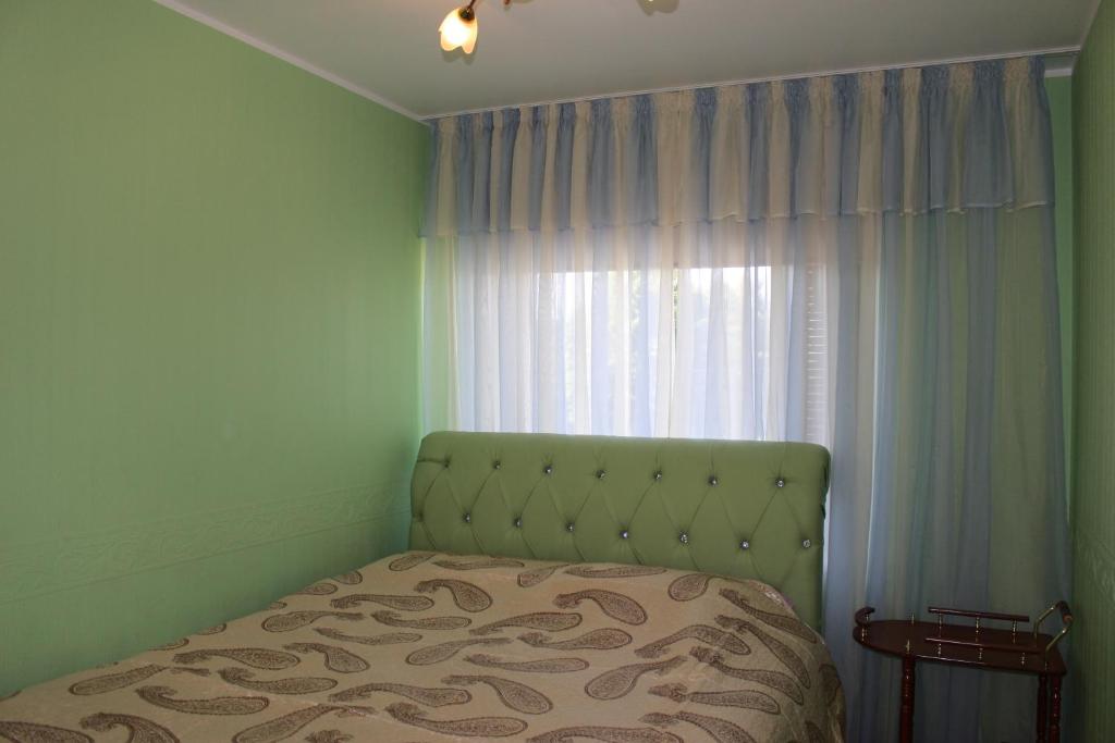 Postel nebo postele na pokoji v ubytování Fortuna Apartments