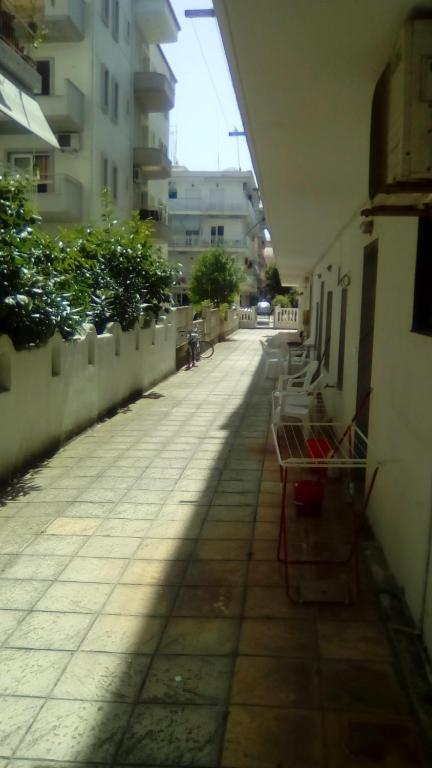 an empty street in a city with buildings at Aleksandros Apartments in Paralia Katerinis