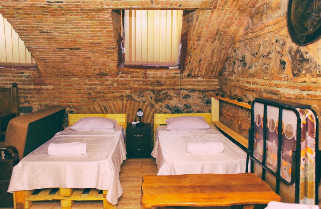 Postel nebo postele na pokoji v ubytování Guest House Kakabadzeebi 9