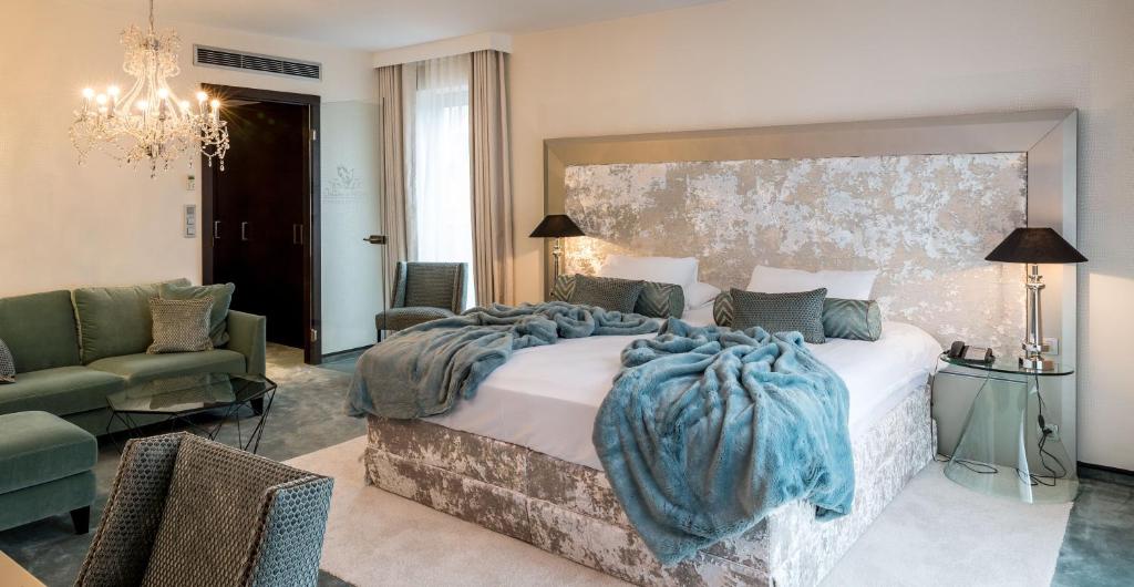 Postel nebo postele na pokoji v ubytování Le Chateau Des Thermes