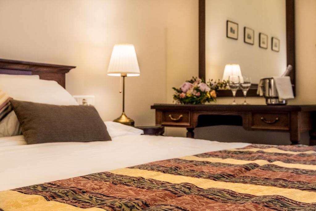 Postel nebo postele na pokoji v ubytování Rex Hotel