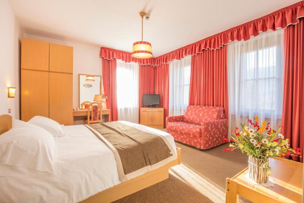 Postel nebo postele na pokoji v ubytování Hotel Villa Trieste