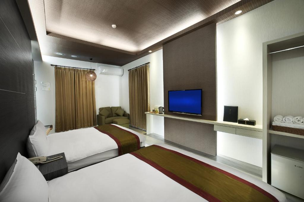 TV a/nebo společenská místnost v ubytování One Fukun Hotel