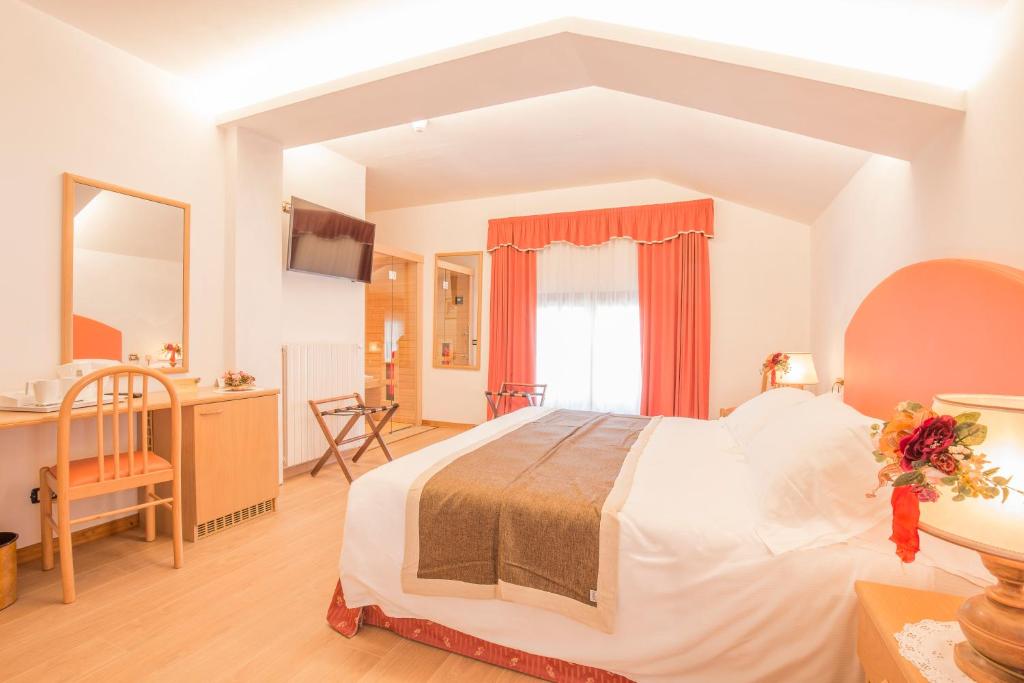 Postel nebo postele na pokoji v ubytování Hotel Villa Trieste