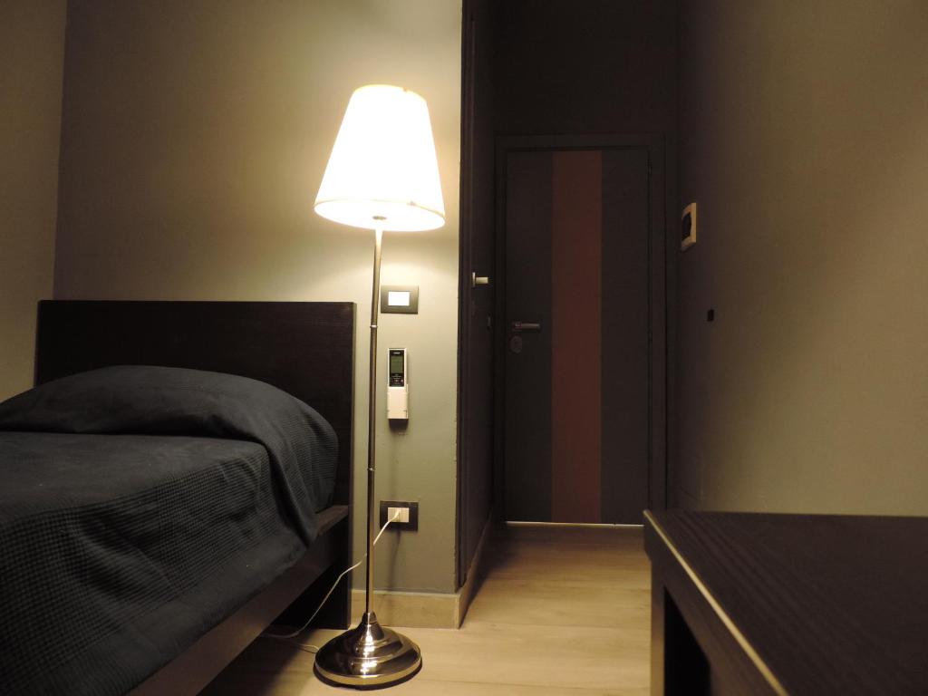 Postel nebo postele na pokoji v ubytování Corridoni Suites