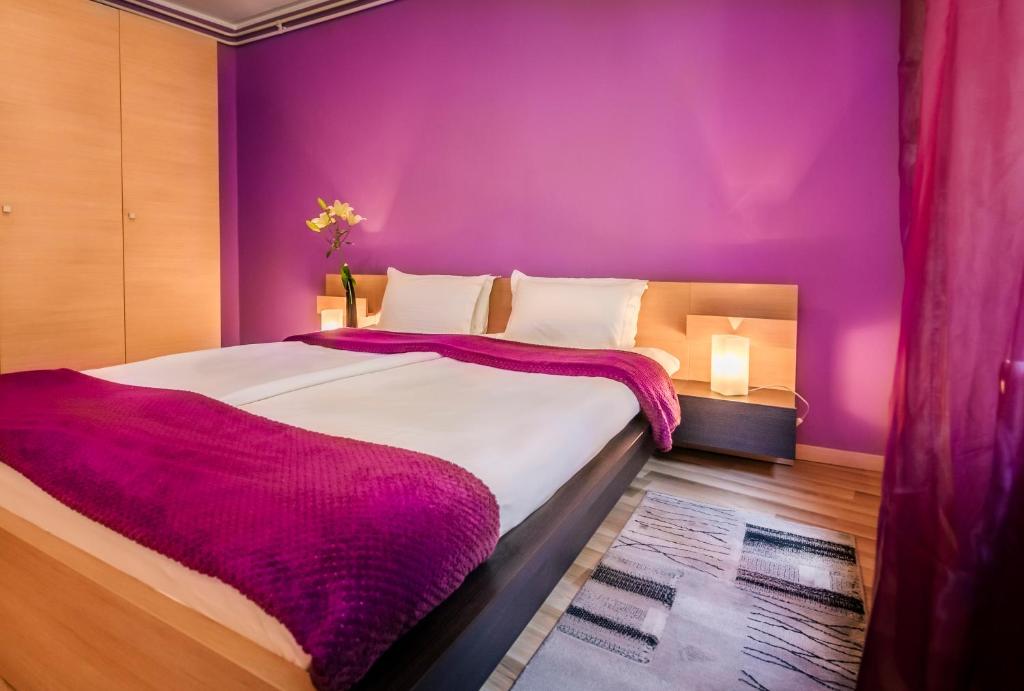 Postel nebo postele na pokoji v ubytování Veliki Garni Hotel