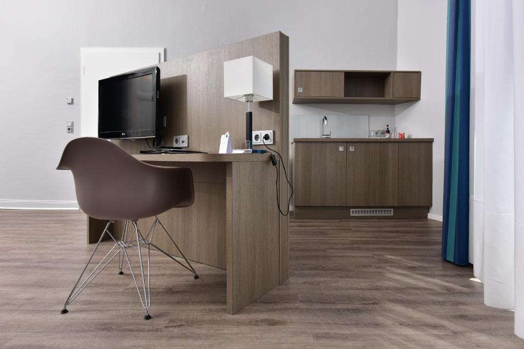 TV a/nebo společenská místnost v ubytování Frühlings-Hotel