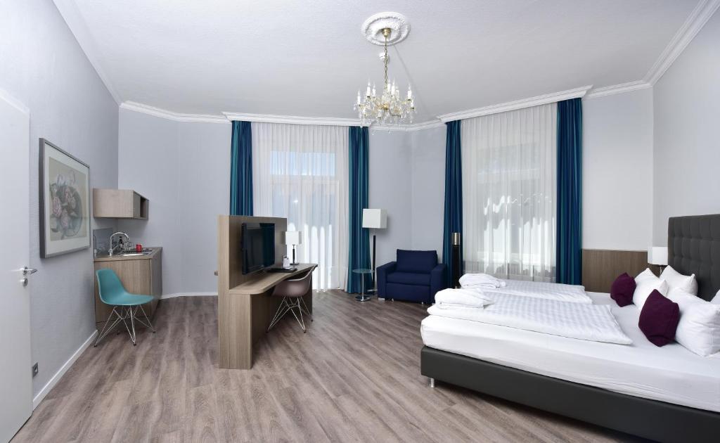 Postel nebo postele na pokoji v ubytování Frühlings-Hotel