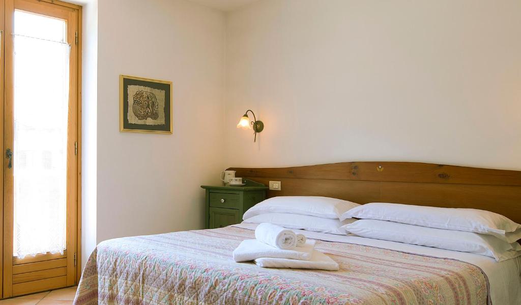 Postel nebo postele na pokoji v ubytování Residence Rio Piccolo